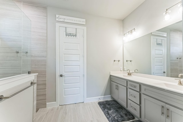 6313 Hedgecoxe Rd, The Colony, TX 75056 - full bath featuring double vanity, walk in shower, and baseboards