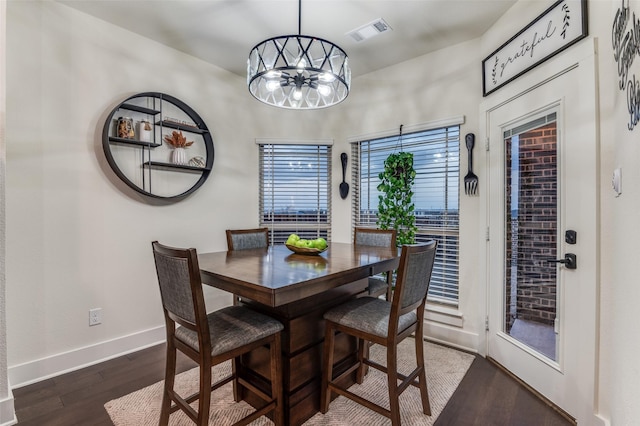 1405 Thunder Dove Dr, Mansfield, TX 76084 - dining room featuring dark wood-type flooring, baseboards, and a chandelier