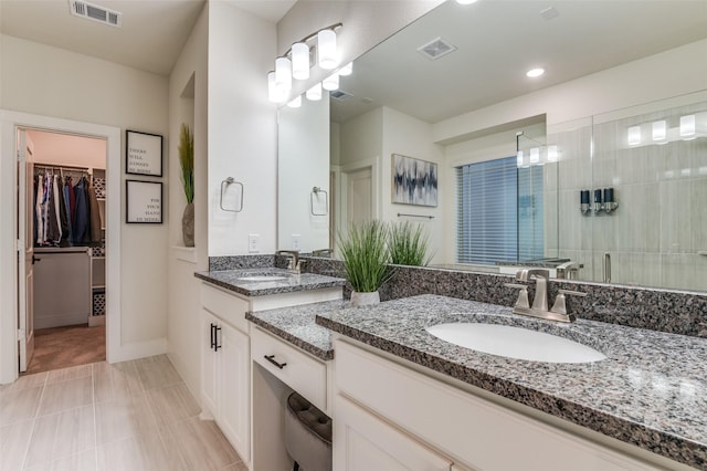 1405 Thunder Dove Dr, Mansfield, TX 76084 - bathroom featuring vanity, a stall shower, a spacious closet, recessed lighting, and baseboards