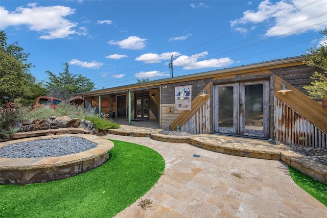 14250 Chaparral Ln, Roanoke, TX 76262 - rear view of house with french doors and a patio area