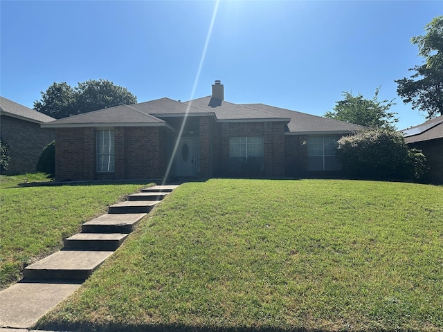 1512 Straus Rd, Cedar Hill, TX 75104 - ranch-style house with a front yard, brick siding, and a chimney