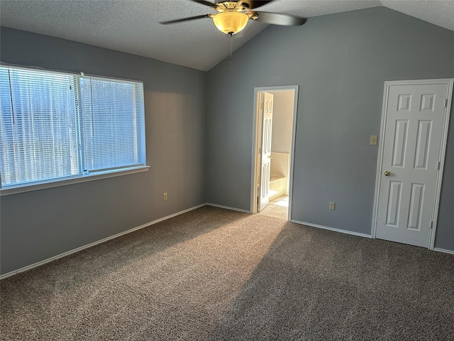 1512 Straus Rd, Cedar Hill, TX 75104 - unfurnished bedroom featuring carpet floors, lofted ceiling, ensuite bathroom, baseboards, and ceiling fan