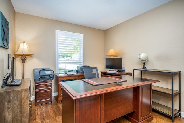 140 Daisey Ln, Justin, TX 76247 - home office with dark wood-style floors and baseboards