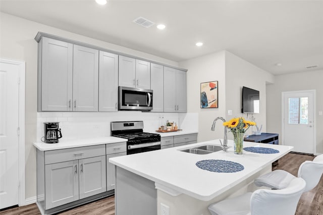 4925 Westhill Dr, Princeton, TX 75071 - kitchen with stainless steel appliances, gray cabinetry, light wood-style floors, a sink, and recessed lighting