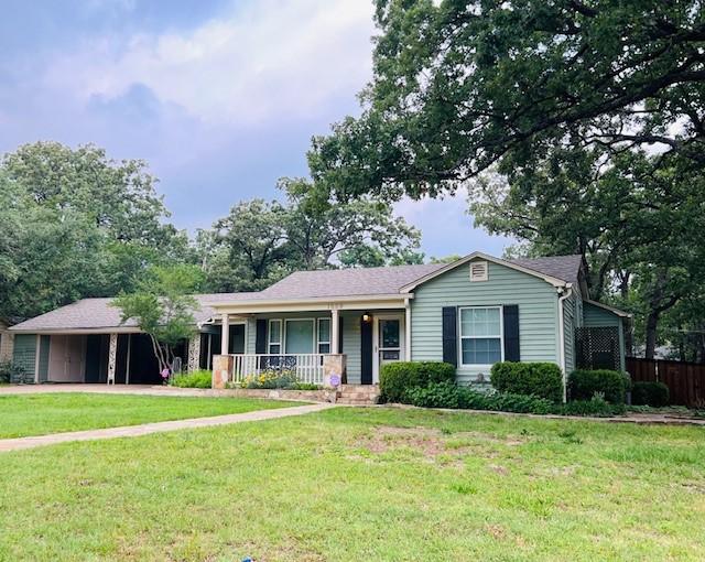 1509 W Hull St, Denison, TX 75020 - single story home with a porch, a carport, and driveway