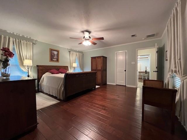 1509 W Hull St, Denison, TX 75020 - bedroom featuring dark wood-style flooring, ornamental molding, ceiling fan, and baseboards