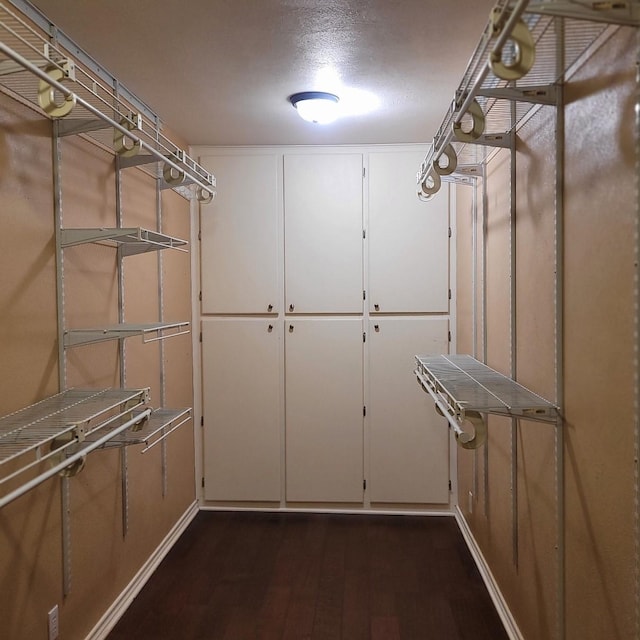 1509 W Hull St, Denison, TX 75020 - walk in closet featuring dark wood finished floors
