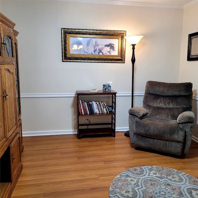 1509 W Hull St, Denison, TX 75020 - living area featuring light wood finished floors, ornamental molding, and baseboards