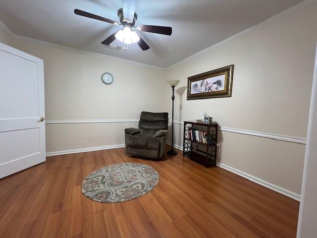 1509 W Hull St, Denison, TX 75020 - sitting room with ceiling fan, wood finished floors, crown molding, and baseboards