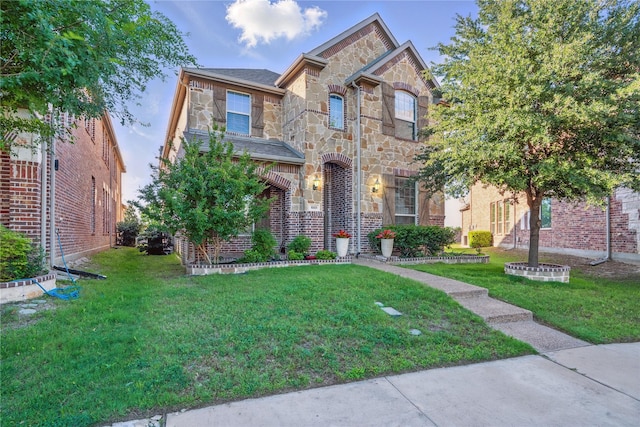 1001 Vineyard Dr, Euless, TX 76039 - view of front of home featuring stone siding and a front lawn