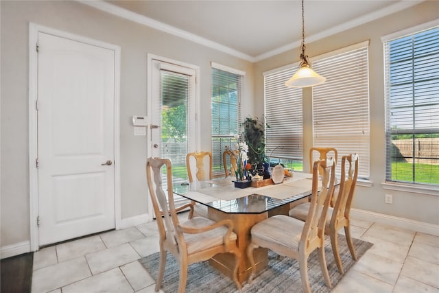 1001 Vineyard Dr, Euless, TX 76039 - dining room with ornamental molding, light tile patterned floors, baseboards, and plenty of natural light