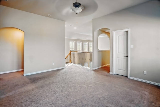 1001 Vineyard Dr, Euless, TX 76039 - carpeted spare room with ceiling fan, arched walkways, and baseboards