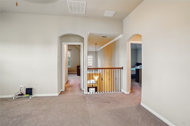 1001 Vineyard Dr, Euless, TX 76039 - corridor with arched walkways, carpet flooring, and baseboards