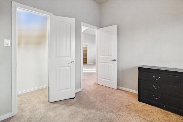 1001 Vineyard Dr, Euless, TX 76039 - unfurnished bedroom with carpet floors, baseboards, and arched walkways