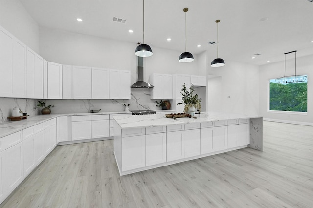 320 Bentwood Dr, Pottsboro, TX 75076 - kitchen featuring wall chimney exhaust hood, decorative backsplash, light wood-style flooring, white cabinets, and recessed lighting
