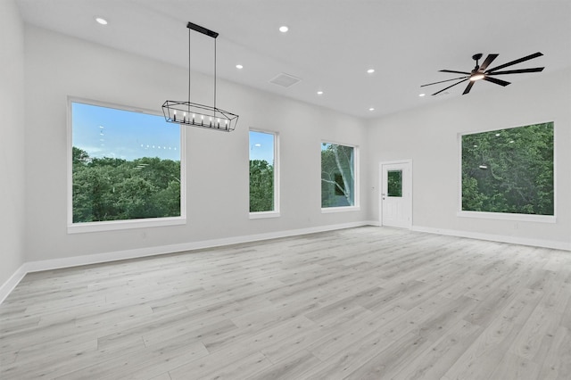320 Bentwood Dr, Pottsboro, TX 75076 - unfurnished room featuring plenty of natural light, recessed lighting, light wood-style floors, a chandelier, and baseboards
