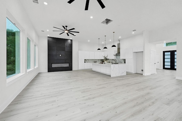 320 Bentwood Dr, Pottsboro, TX 75076 - unfurnished living room featuring recessed lighting, a ceiling fan, plenty of natural light, and light wood-style flooring