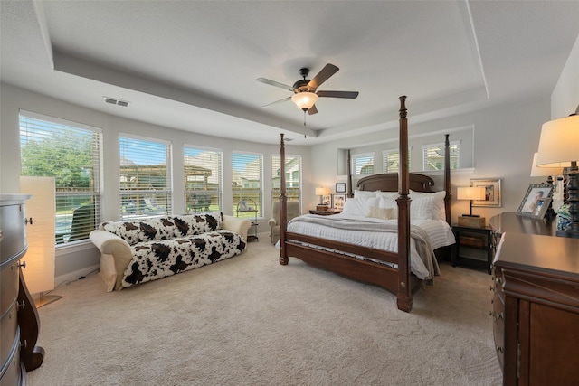 760 Ascot Ct, Prosper, TX 75078 - bedroom featuring a raised ceiling, light carpet, and a ceiling fan