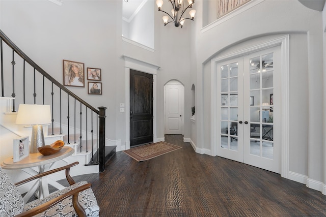 760 Ascot Ct, Prosper, TX 75078 - entrance foyer with wood finished floors, stairs, arched walkways, baseboards, and a chandelier
