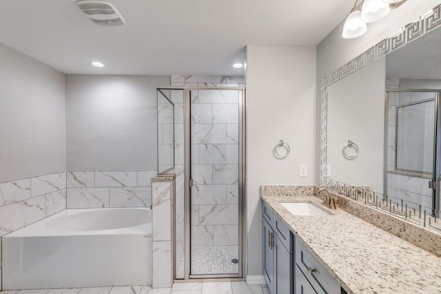 5520 Curzon Ave, Fort Worth, TX 76107 - full bathroom with a bath, marble look tiles, vanity, a stall shower, and recessed lighting