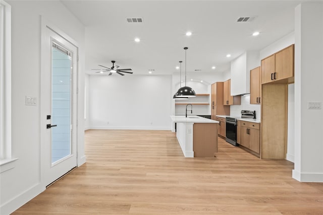 2820 Barnes Bridge Rd, Dallas, TX 75228 - kitchen featuring electric range, a sink, open floor plan, light countertops, and backsplash
