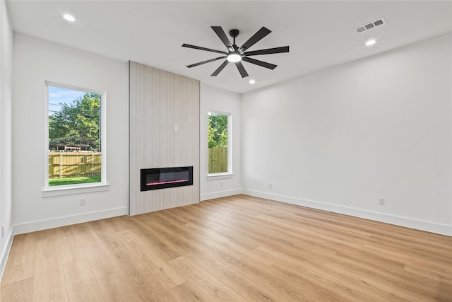 2820 Barnes Bridge Rd, Dallas, TX 75228 - unfurnished living room featuring a large fireplace, wood finished floors, baseboards, recessed lighting, and a ceiling fan