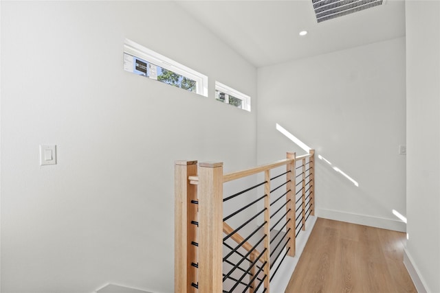 1332 Fletcher St, Dallas, TX 75223 - staircase with wood finished floors, baseboards, and recessed lighting
