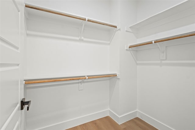 1332 Fletcher St, Dallas, TX 75223 - walk in closet featuring wood finished floors