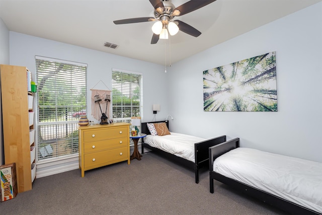 1015 W Bluff St, Fort Worth, TX 76102 - bedroom with carpet floors and a ceiling fan