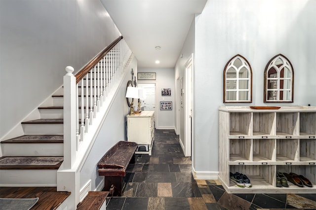 1015 W Bluff St, Fort Worth, TX 76102 - stairs with baseboards, stone finish flooring, and recessed lighting