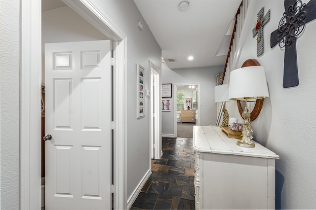 1015 W Bluff St, Fort Worth, TX 76102 - hall with stone tile flooring, baseboards, and recessed lighting