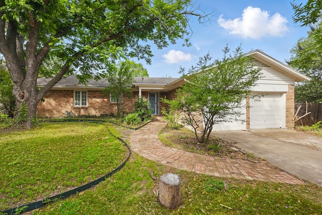 4900 Vega Ct E, Fort Worth, TX 76133 - view of front of house with driveway, brick siding, and an attached garage
