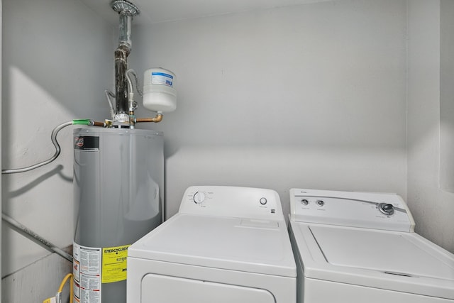 4900 Vega Ct E, Fort Worth, TX 76133 - washroom with water heater and washing machine and dryer