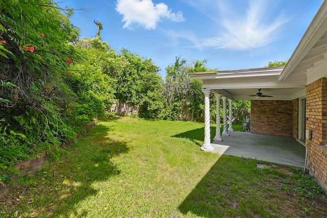 4900 Vega Ct E, Fort Worth, TX 76133 - view of grassy yard with ceiling fan and a patio area