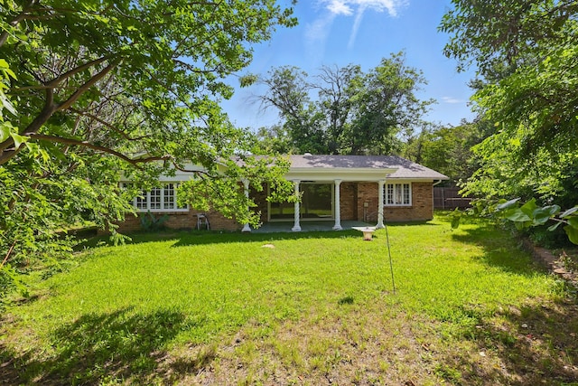 4900 Vega Ct E, Fort Worth, TX 76133 - back of property with brick siding and a patio area