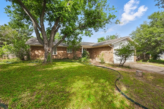4900 Vega Ct E, Fort Worth, TX 76133 - view of front of house with driveway, a garage, a front yard, and brick siding