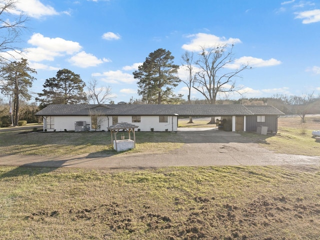 339 County Road 4315, Naples, TX 75568 - view of front of home with asphalt driveway, a front lawn, and an attached carport