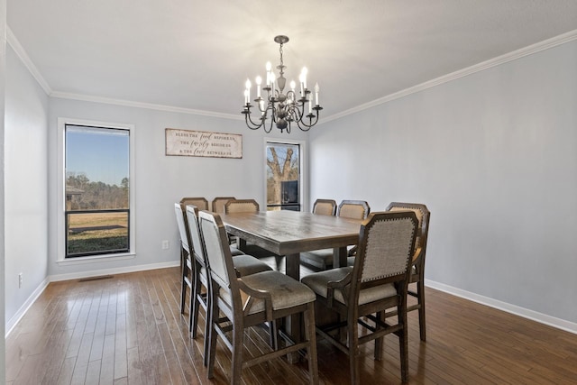 339 County Road 4315, Naples, TX 75568 - dining space featuring a chandelier, dark wood-style flooring, ornamental molding, and baseboards