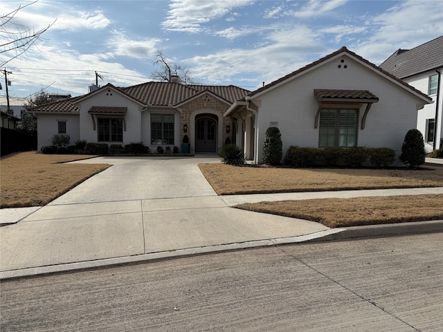 132 Pineland Pl, Fort Worth, TX 76114 - mediterranean / spanish-style home with a tile roof, driveway, a front lawn, and a chimney