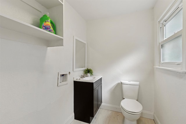 4104 Middlebrook Rd, Fort Worth, TX 76116 - bathroom with vanity, wood finished floors, baseboards, and toilet