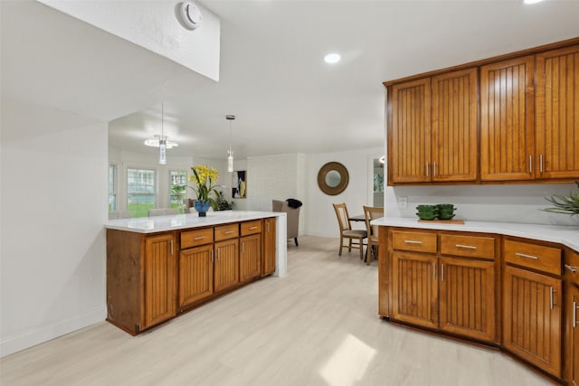 4104 Middlebrook Rd, Fort Worth, TX 76116 - kitchen with light wood-style flooring, light countertops, brown cabinetry, and recessed lighting