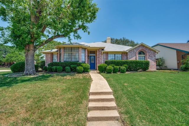 4500 Keys Dr, The Colony, TX 75056 - ranch-style house featuring a chimney, brick siding, and a front lawn
