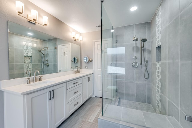 4500 Keys Dr, The Colony, TX 75056 - bathroom featuring a stall shower, double vanity, recessed lighting, and tile patterned flooring
