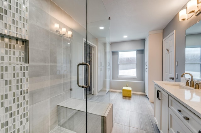 4500 Keys Dr, The Colony, TX 75056 - full bathroom with vanity, tiled shower, recessed lighting, and baseboards