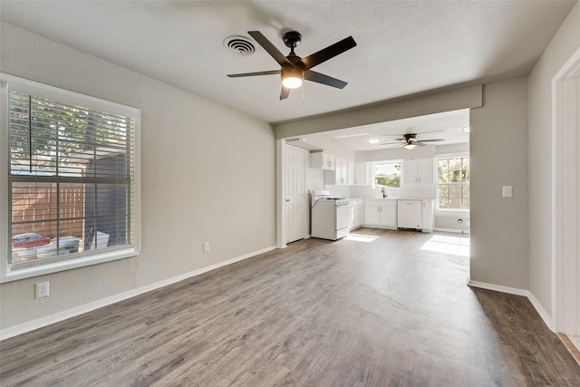1822 Roberts Cut Off Rd, Fort Worth, TX 76114 - unfurnished living room with ceiling fan, wood finished floors, and baseboards