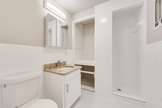 1822 Roberts Cut Off Rd, Fort Worth, TX 76114 - full bathroom featuring toilet, vanity, tile walls, a shower, and wainscoting