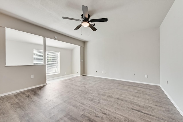 1822 Roberts Cut Off Rd, Fort Worth, TX 76114 - empty room with ceiling fan, wood finished floors, and baseboards