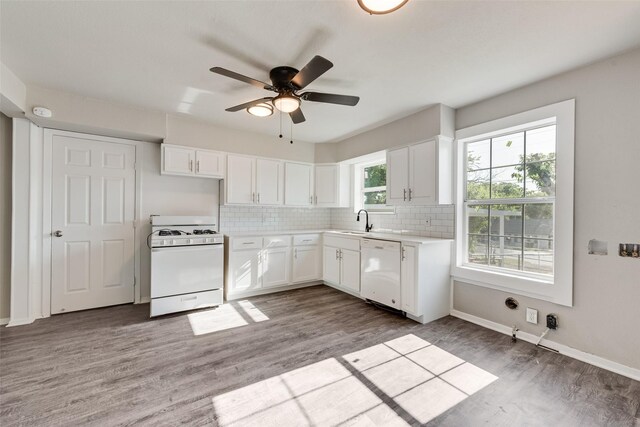 1822 Roberts Cut Off Rd, Fort Worth, TX 76114 - kitchen featuring white appliances, light wood finished floors, backsplash, white cabinets, and a ceiling fan