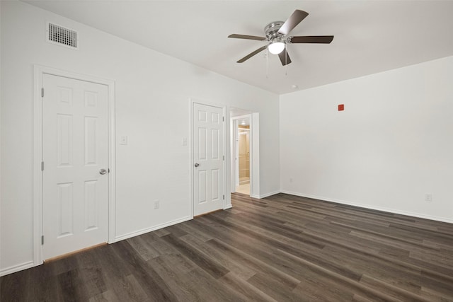 11218 Park Central Pl Unit B, Dallas, TX 75230 - unfurnished bedroom with dark wood-type flooring, baseboards, ensuite bath, and a ceiling fan