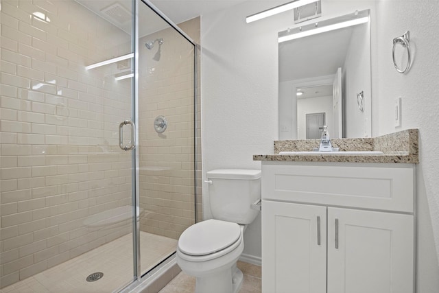 11218 Park Central Pl Unit B, Dallas, TX 75230 - bathroom featuring toilet, a stall shower, vanity, a textured wall, and tile patterned flooring